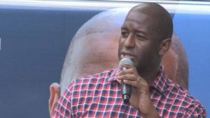 Man speaking in to microphone